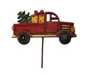 Camion rouge avec cadeau et sapin