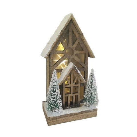 Maison lumineuse en bois avec motif géométrique et sapins enneigés