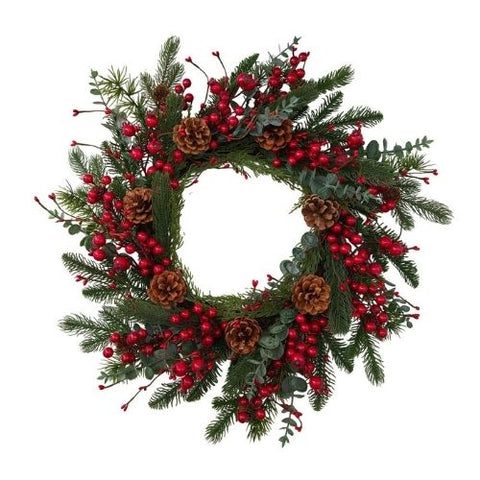 Couronne de pin verte avec baies rouges et pommes de pin