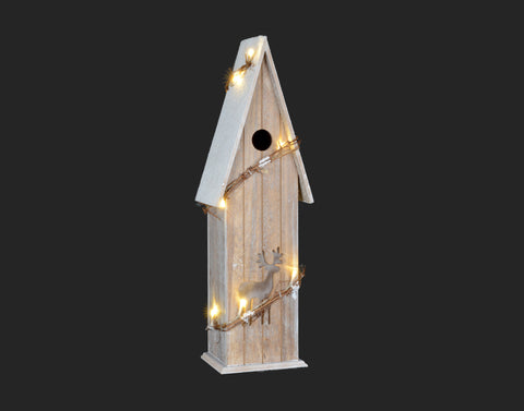 Cabane d'oiseaux illuminée