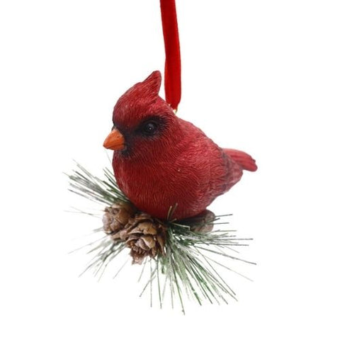 Ornement de cardinal rouge sur branche