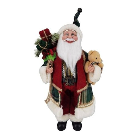 Père Noël debout en manteau rouge et vert avec ours en peluche