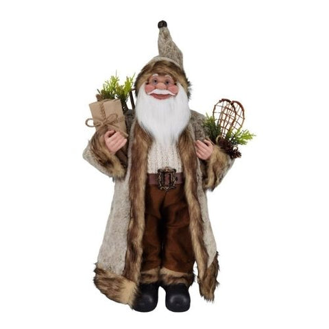 Père Noël debout en manteau brun avec raquette à neige