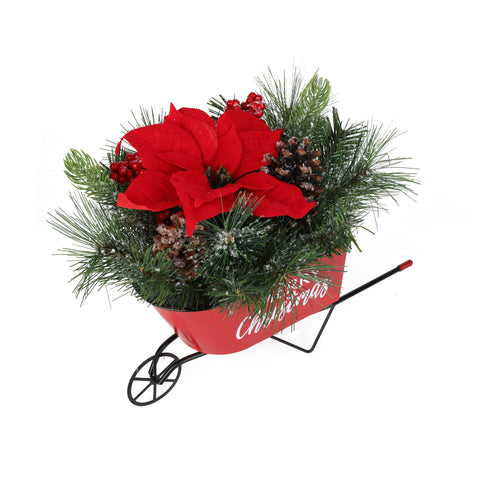 Arrangement de Noël dans une mini brouette rouge