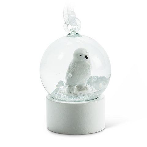 Boule de neige avec harfang des neiges