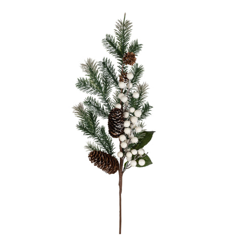 Branche de pin enneigée avec cocottes et baies blanches