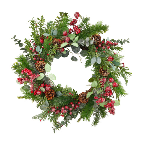 Couronne de Noël avec pommes de pin, baies rouges et verdure givrée