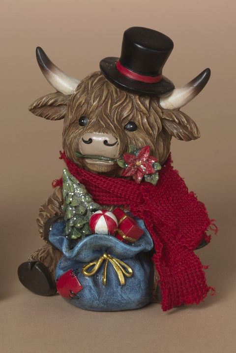 Vache Highland festive en résine avec sac de cadeaux