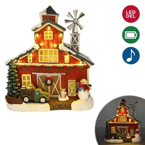 Grange de Noël lumineuse avec moulin, camion et bonhomme de neige