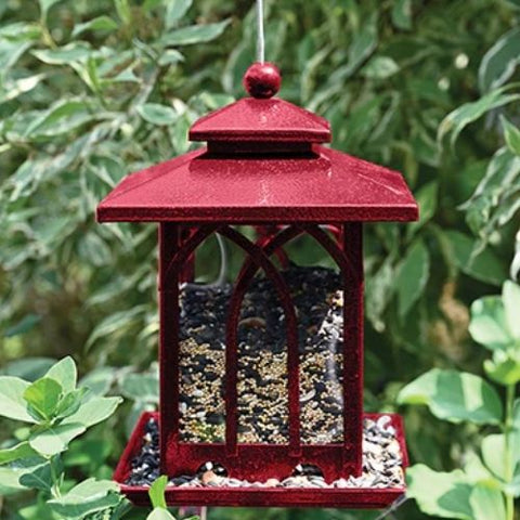 Mangeoire à oiseaux rouge avec fenêtres