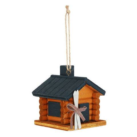 Ornement cabane en bois avec skis