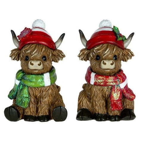 Vaches Highland décoratives avec bonnet et foulard de Noël